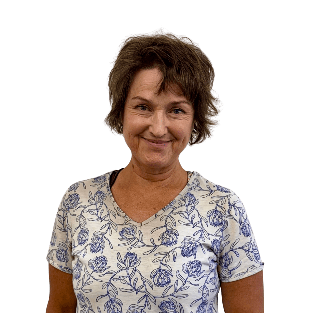 A woman in a blue and white floral shirt.