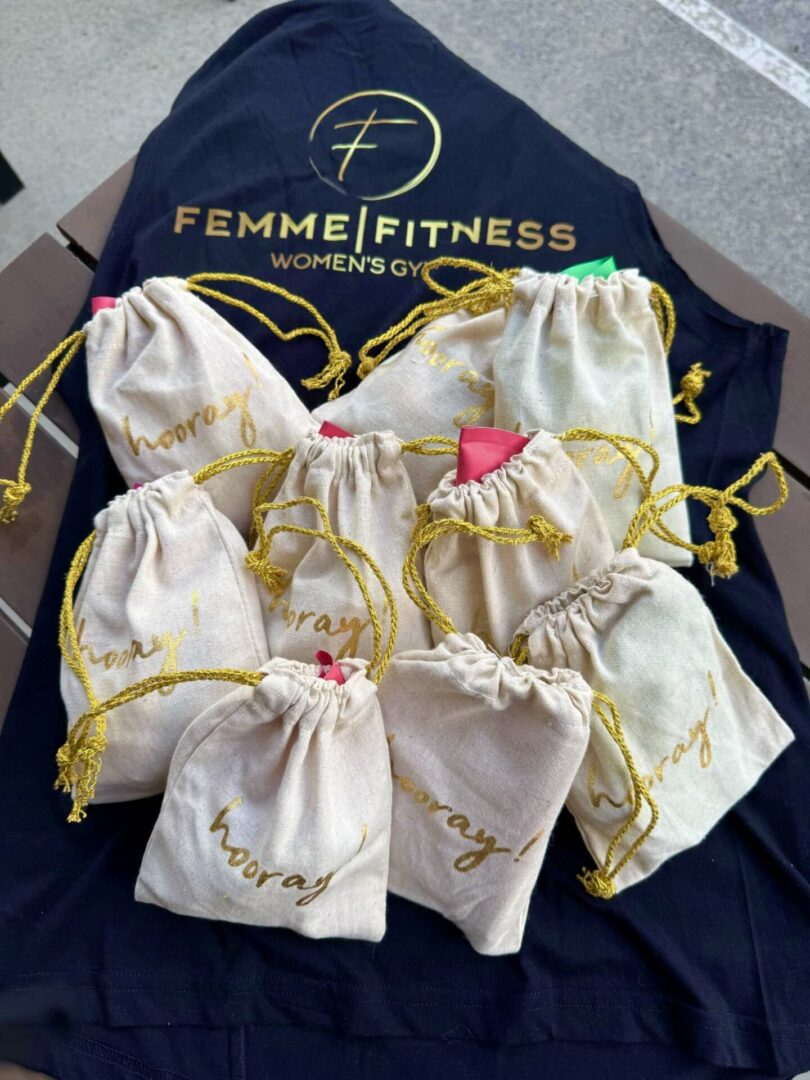 A group of bags that are on top of a t shirt.